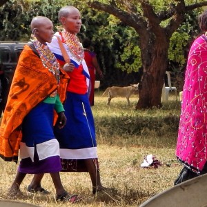 Women draped in beaded jewelry