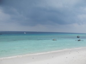 The ocean glowed under dark skies